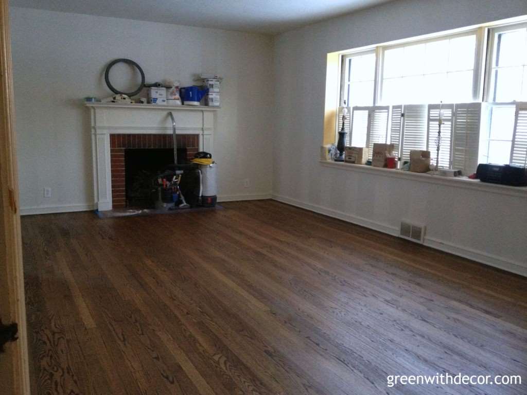 Hardwood flooring in a room with white striped walls