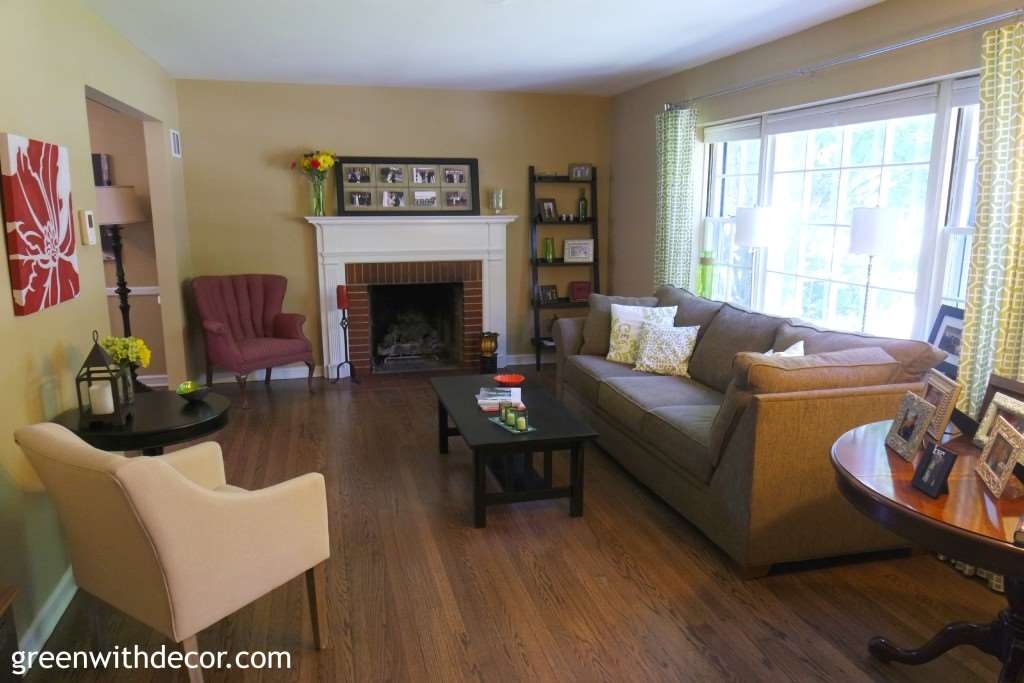 Tan living room with hardwood floors and a dark couch
