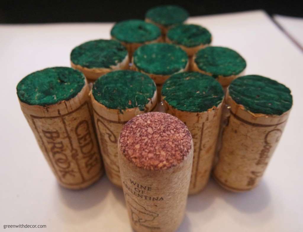 Wine corks arranged in a tree shape with the ends colored green 