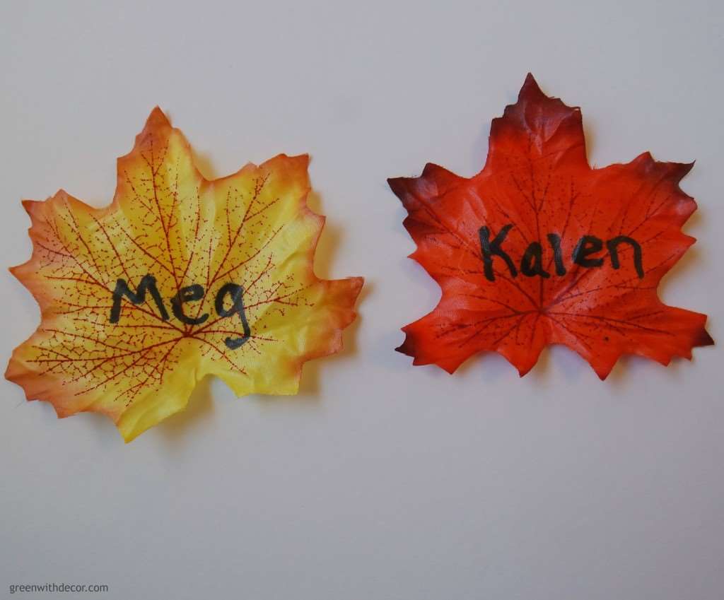 Two take fall leaves with the names Meg and Kalen written on them