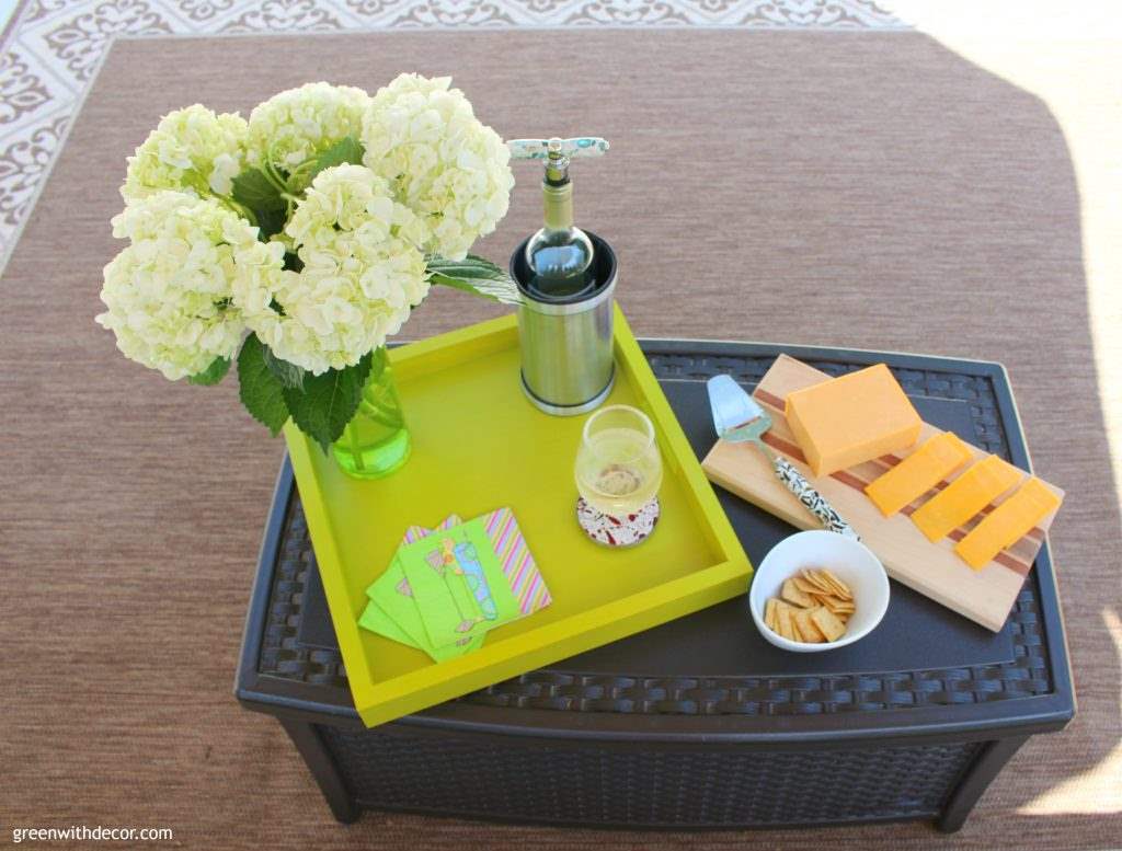 Wine and cheese on the patio! And those cool recycled glass colorful kitchen gadgets! I wish I had this colorful patio. What a fun place to relax!