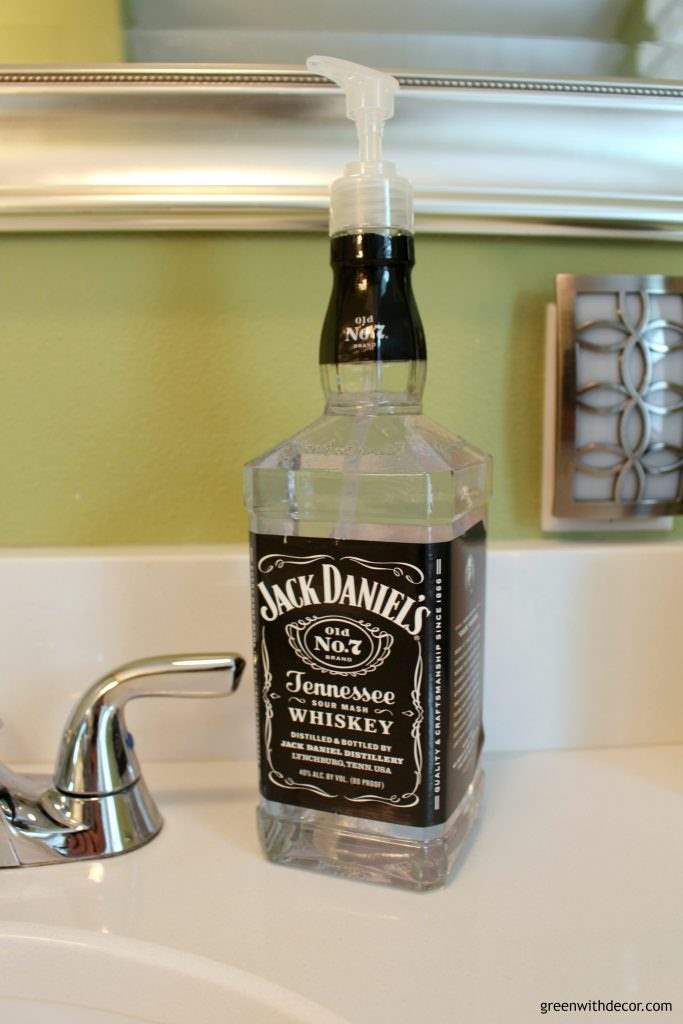 A DIY Jack Daniels soap dispenser on a white counter