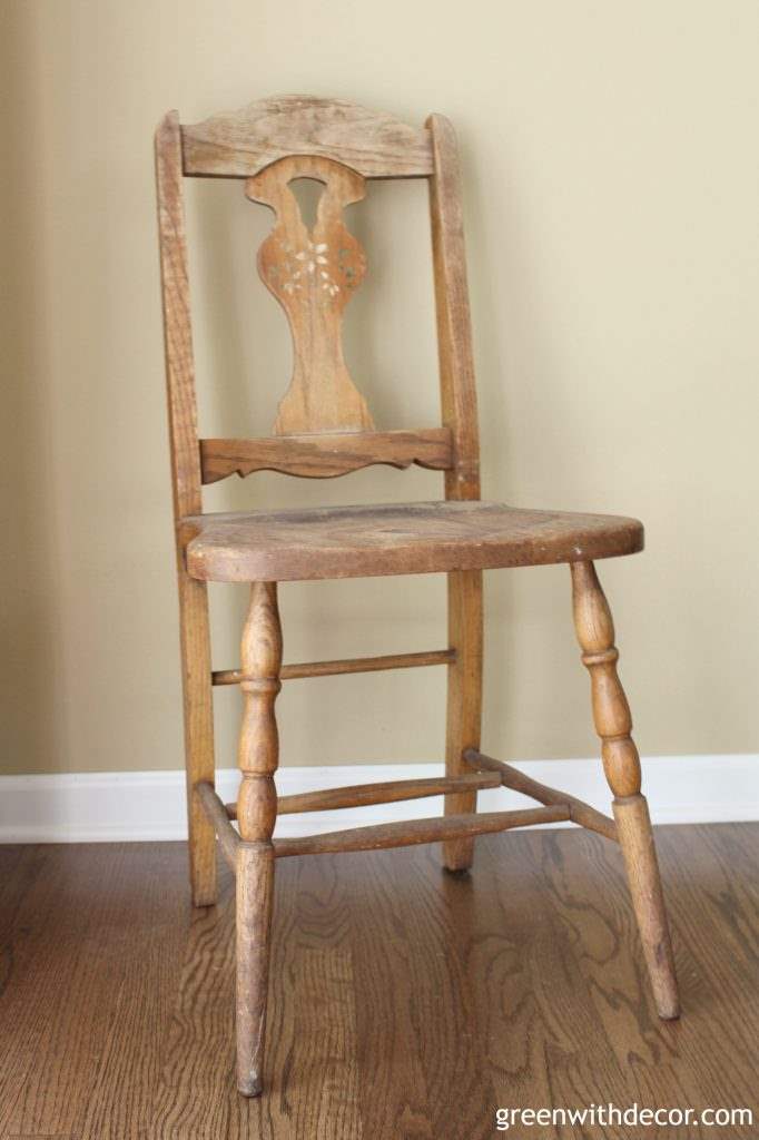 And old chair sits against a wall in anticipation of being painted