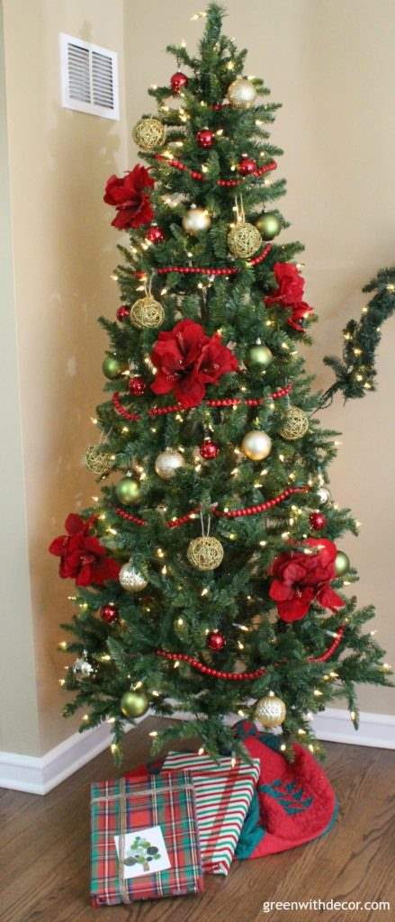 A Christmas tree decorated in red and gold