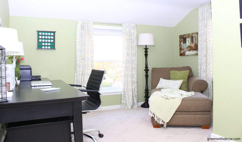 Ryegrass green home office with a black desk and a neutral chaise in the corner