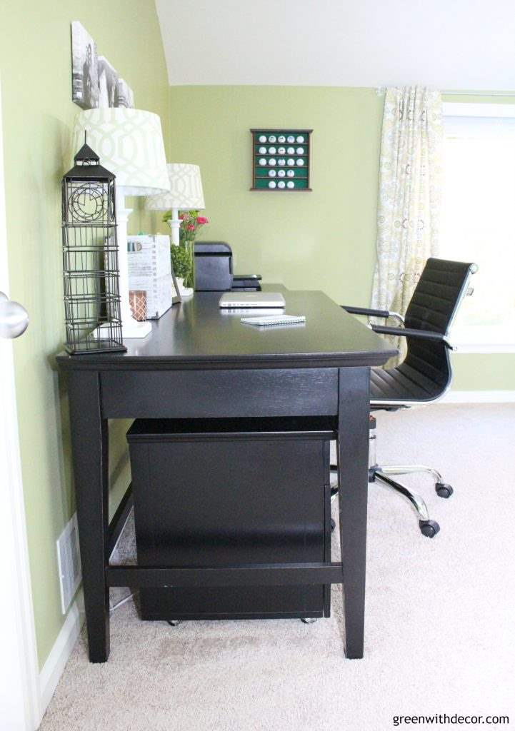 Green painted home office with black furniture