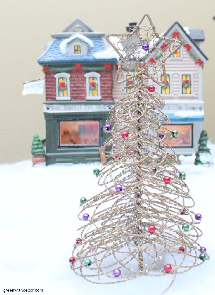 This blogger has such a great Christmas village. I love how she adds sentimental pieces each year and always on a budget. She even found a village piece at Goodwill – love her ideas! 