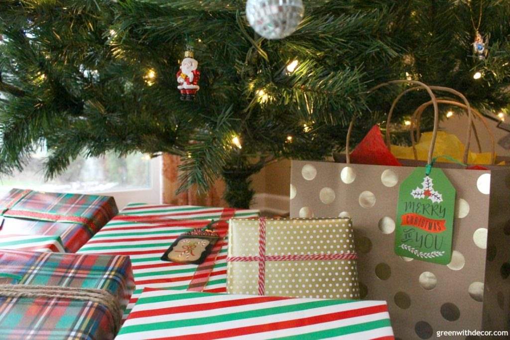 Love this classic Christmas family room! Such great decorating ideas plus easy gift wrapping ideas. Love the twine instead of big fancy ribbons. Plus all those throw pillows and the lantern!