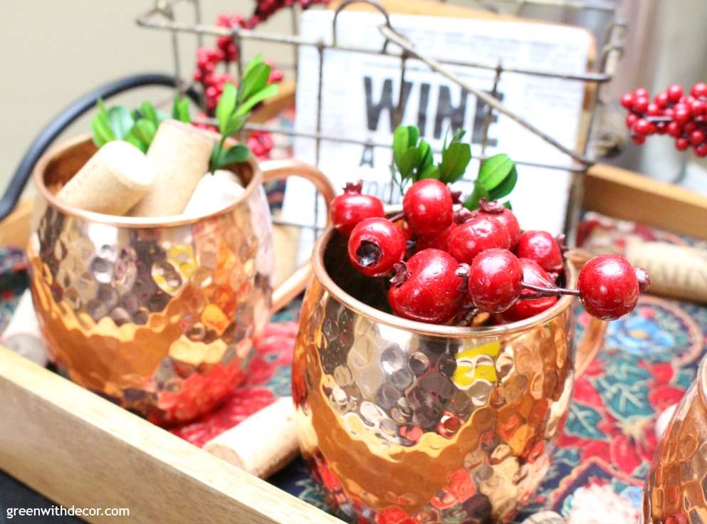 7 tips for setting up a holiday cocktail bar. Love her use of trays and the wreath, I wouldn’t have thought of that! And how festive are those straws and Christmas towel. This looks so festive!