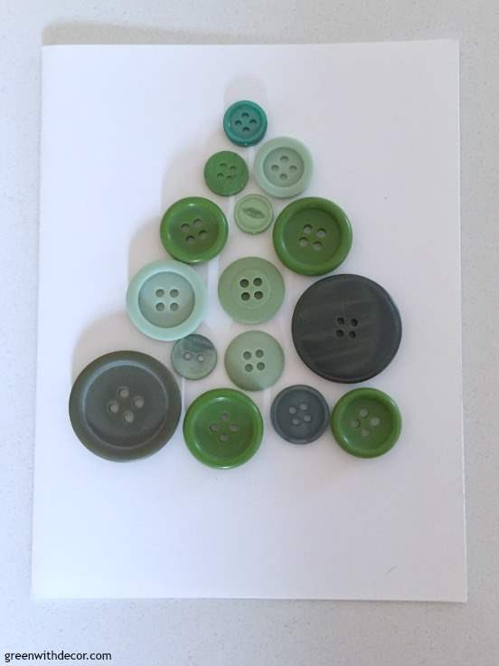 Place the buttons on the card in the shape of a tree