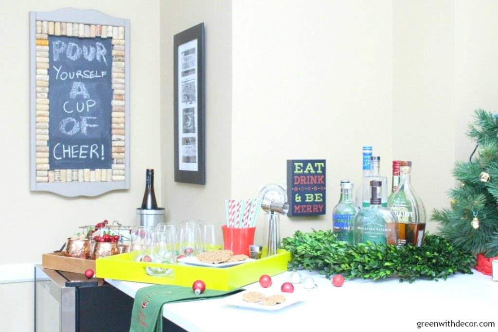 7 tips for setting up a holiday cocktail bar. Love her use of trays and the wreath, I wouldn’t have thought of that! And how festive are those straws and Christmas towel. This looks so festive!