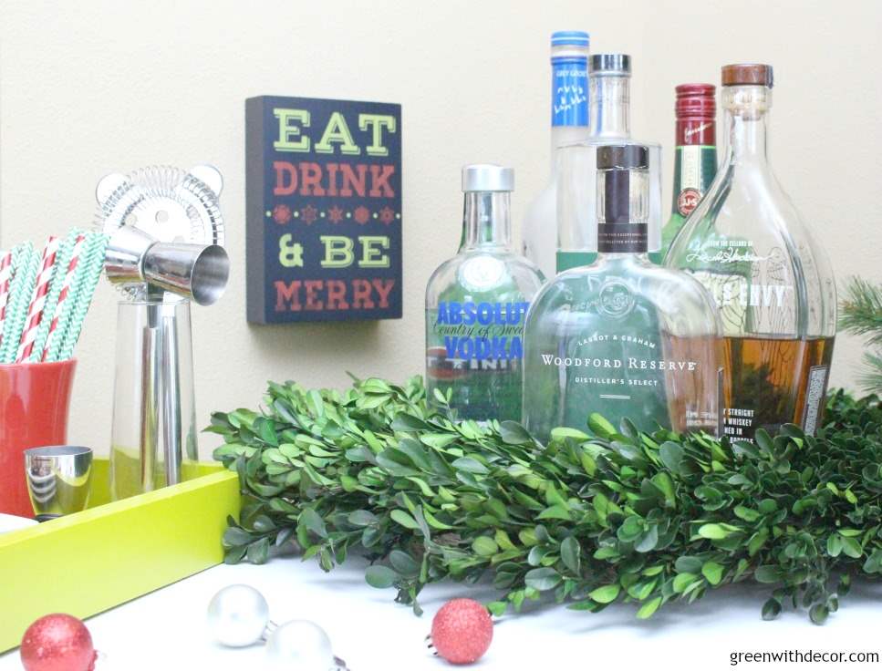 7 tips for setting up a holiday cocktail bar. Love her use of trays and the wreath, I wouldn’t have thought of that! And how festive are those straws and Christmas towel. This looks so festive!