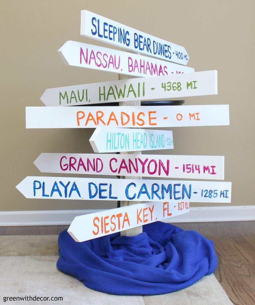 How to make a distance arrow sign so you can remember all of your fabulous vacations. A fun DIY project with a saw and some paint!