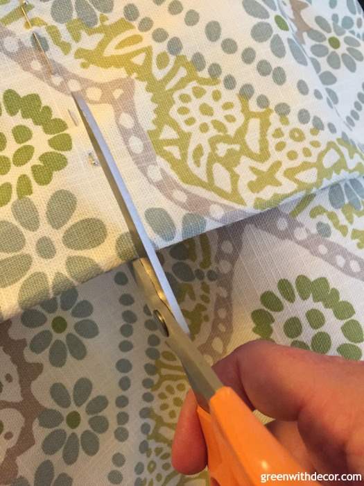 How to DIY a throw pillow from extra fabric. A perfect excuse to make a pillow and a great way to use old fabric instead of throwing it away. Plus you could do this with Christmas or other holiday fabric as a cheap way to get seasonal throw pillows.