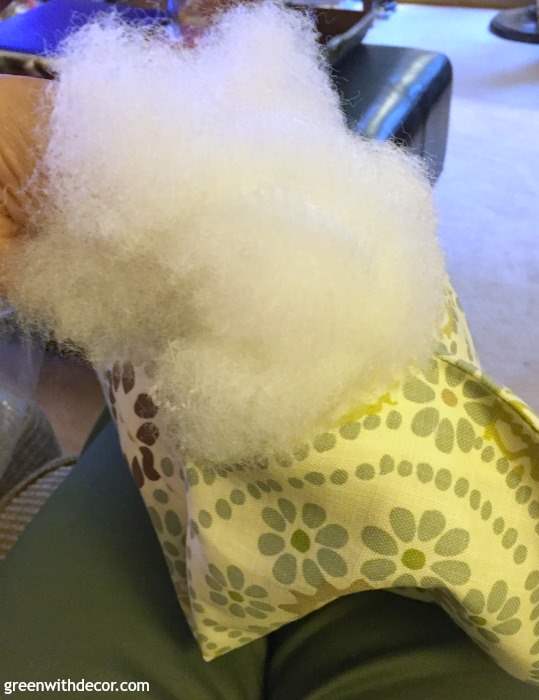 How to DIY a throw pillow from extra fabric. A perfect excuse to make a pillow and a great way to use old fabric instead of throwing it away. Plus you could do this with Christmas or other holiday fabric as a cheap way to get seasonal throw pillows.