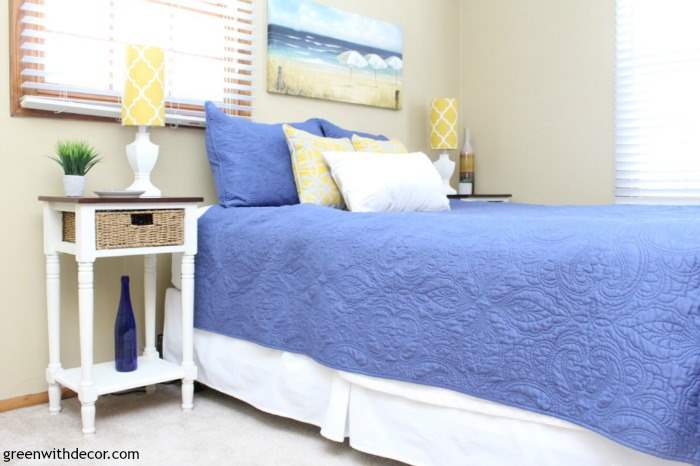 Two-toned painted nightstand makeover in a coastal bedroom with tan walls