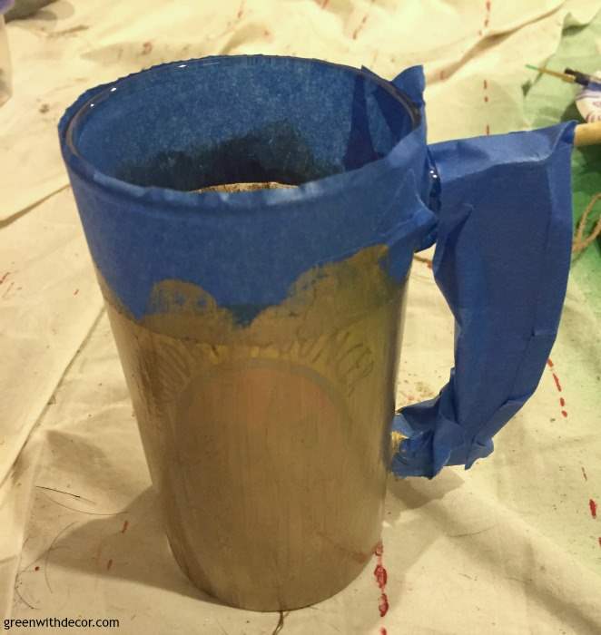 A DIY beer mug vase perfect for St. Patrick's Day! A DIY project with paint and an old beer mug. So festive!