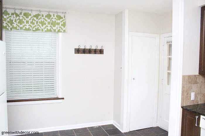 The painted kitchen: Aesthetic White, a great off-white paint color to brighten up a dark kitchen! Love how it looks against the granite counters.