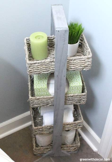 Small bathroom makeover for just $100. Perfect for renters! Love the coastal and farmhouse design - the towel rack is an old wooden spool. Great storage for a small bathroom!