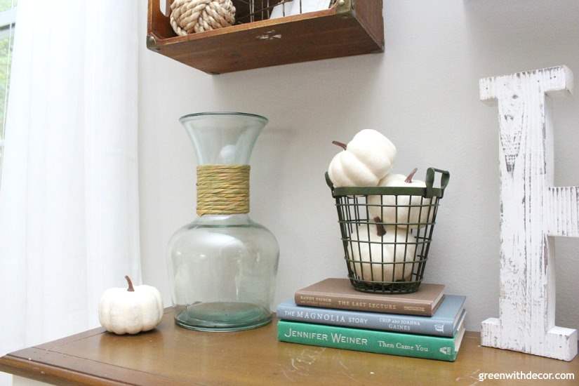 Easy fall decorating ideas for the mudroom, living room, mantel and other areas of the house. Throw some pumpkins and fall colors around and call it a day! Love the pumpkins tossed in this green farmhouse basket!