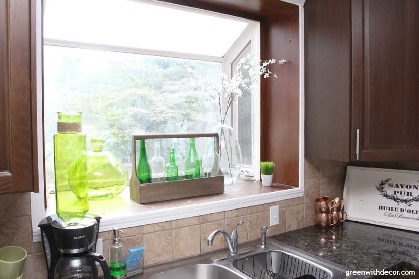 7 ways to update your kitchen when you can't renovate whether you're renting or don't have the budget for a kitchen renovation right now. Love how the different colored glass in the window box gives the kitchen a beachy coastal look.