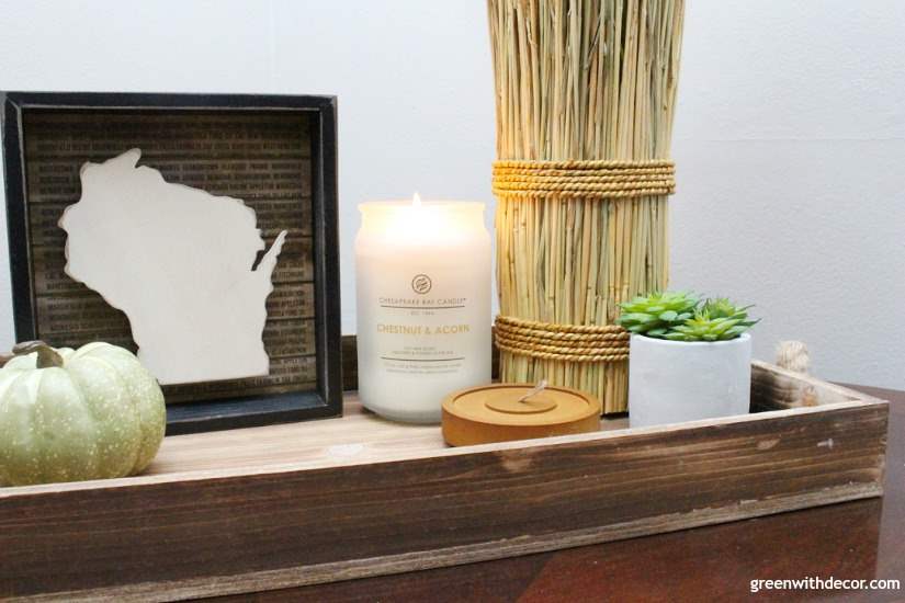 Delicious smelling fall candles in neutral colors. Love this rustic coastal tray and that wood state sign. That candle jar is pretty, too!