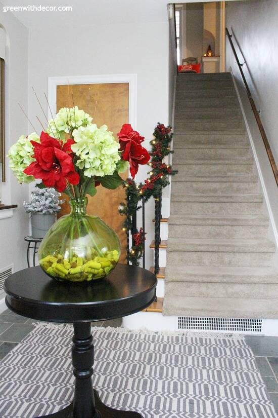 Gorgeous Christmas centerpiece with red and green flowers in that green vase!