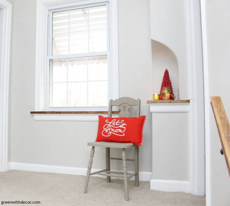 Another look at the red "Let it Snow" pillow on a painted chair in the corner