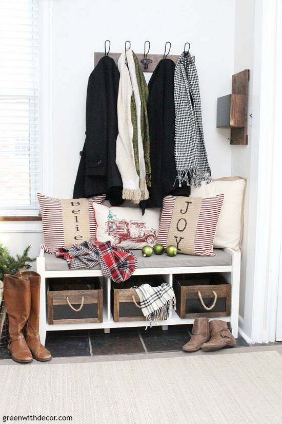 Christmas decorating ideas for the foyer. Love those rustic wood rope crates with the pretty Christmas throw pillows and scarves! Such a pretty neutral Christmas foyer!