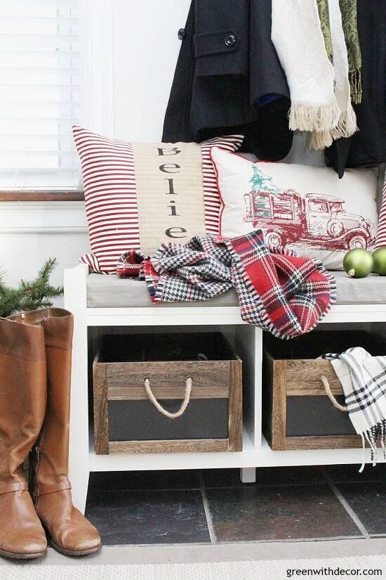 Christmas decorating ideas for the foyer. Love those rustic wood crates with the pretty Christmas throw pillows and scarves! Such a pretty neutral Christmas foyer!