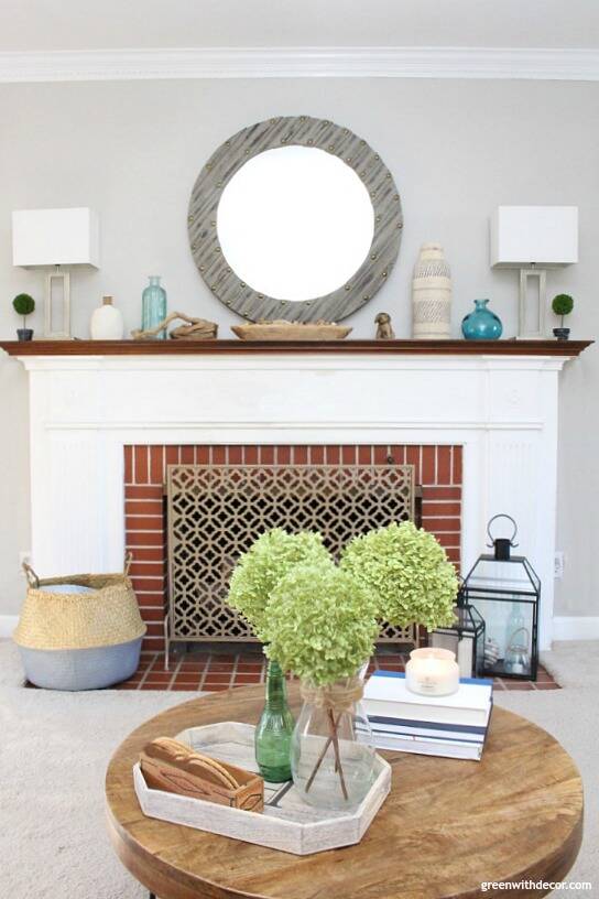 Gorgeous rustic fireplace with accent pieces on display