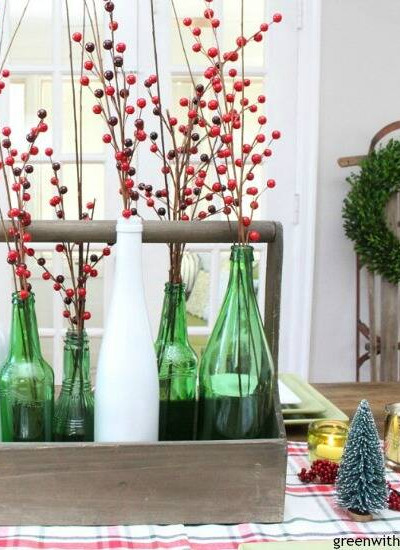 A plaid Christmas centerpiece and tablescape. Love those pretty bottles and that vintage sled!