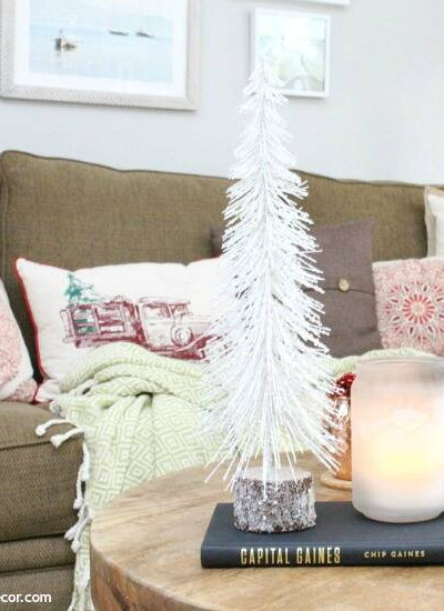 A traditional Christmas living room filled with red, green and metallic decor.
