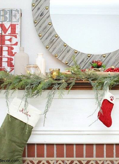 A traditional Christmas mantel - full of red, green, metallic and neutral pieces. Love that farmhouse rustic Be Merry sign!