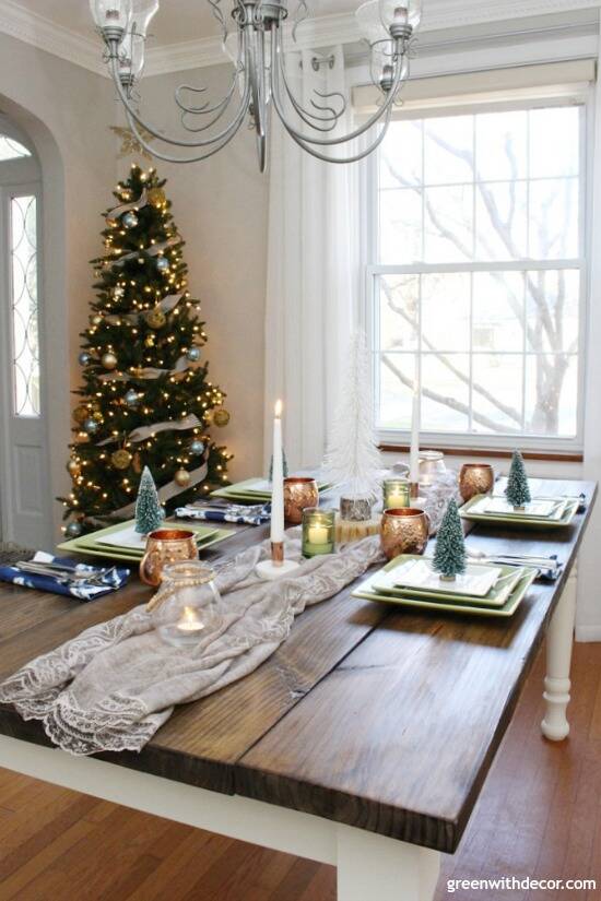 A blue and copper Christmas centerpiece + tablescape - perfect for a costal tablescape! Love the mix of blues, greens and metallics!