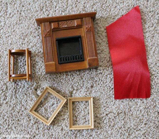 A miniature Christmas living room. So cute to make little Christmas stockings from ribbon for the dollhouse!