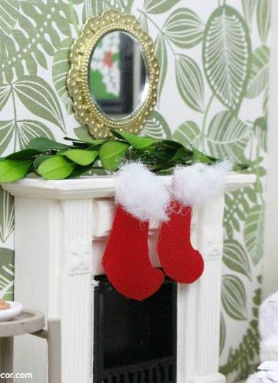 A miniature Christmas living room. Such cute and festive DIY dollhouse ideas for Christmas!