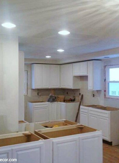 White cabinets installed in the kitchen! If you need a lower cabinet for a tight spot, think about using an upper cabinet.