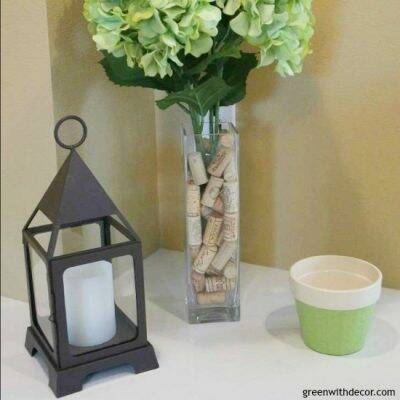 Take a flowerpot that comes with a flower arrangement and spray paint it with a color you like. Then you can reuse the flowerpot!