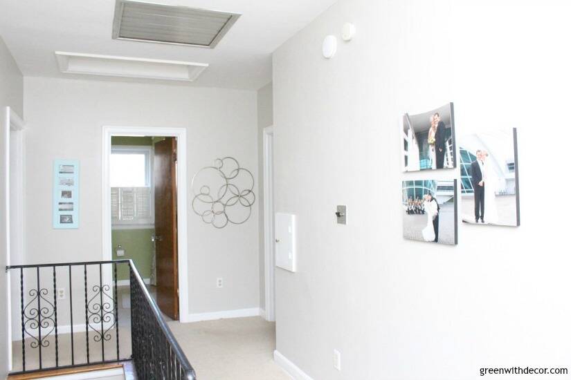 Agreeable Gray hallway with wedding photos and metal circle art on the walls