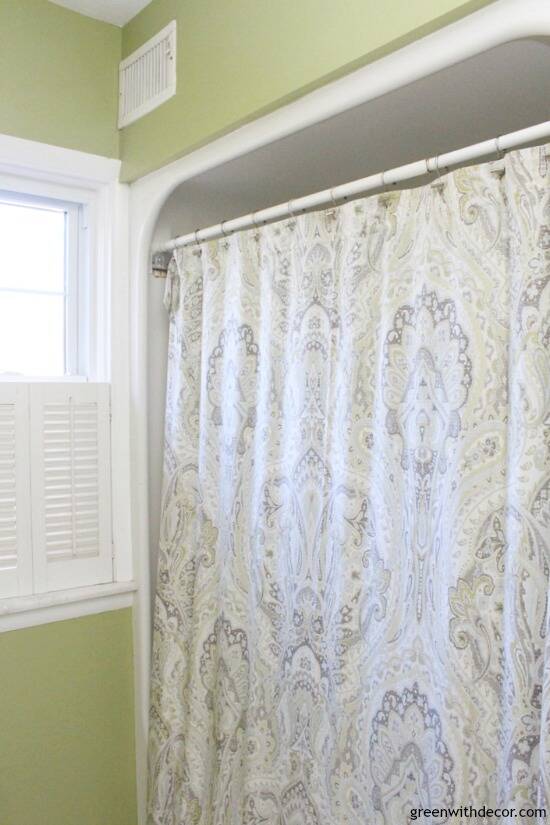 Rental bathroom reveal - a pretty shower curtain is an easy way to add some color and personality!