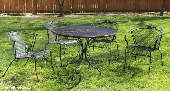 A black metal outdoor patio table and chairs