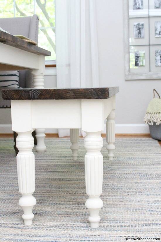 A DIY bench with wood top and white legs