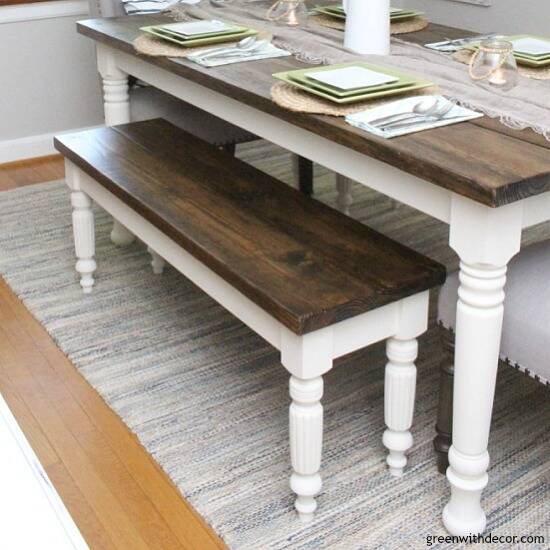 A DIY bench and farmhouse table with dark wood tops and white legs