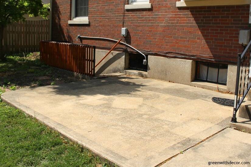 An outdated patio at a brick house