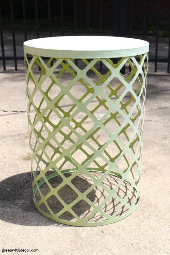 An old green rusty end table in need of spray paint