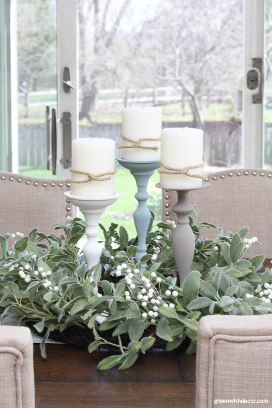 Painted candlesticks on a farmhouse table