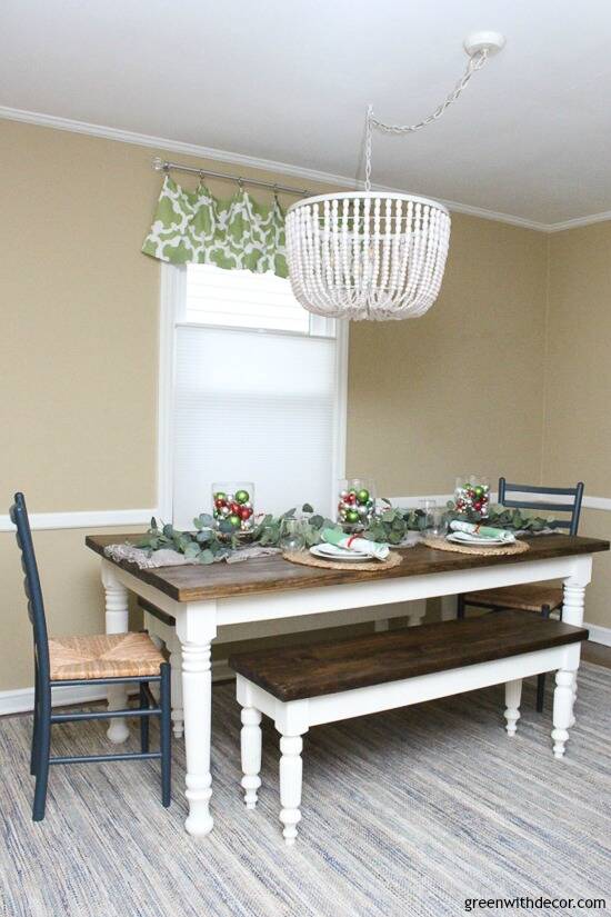 Farmhouse table with Christmas centerpiece and tan walls