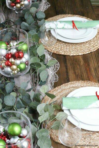 Christmas centerpiece with ornaments and faux eucalyptus stems