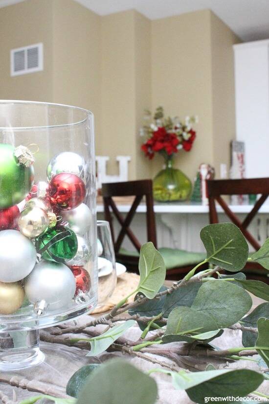 Christmas centerpiece with colored ornaments and faux eucalyptus